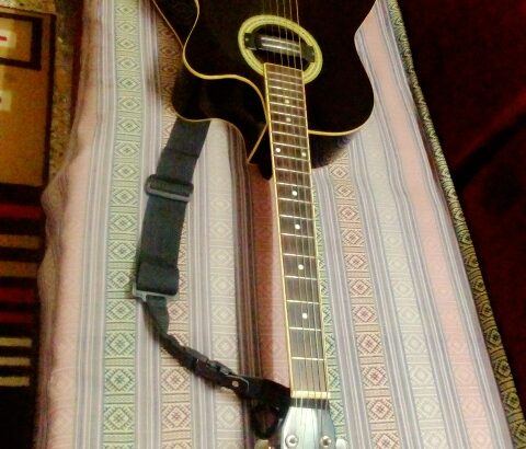 acoustic guitar with bag and belt