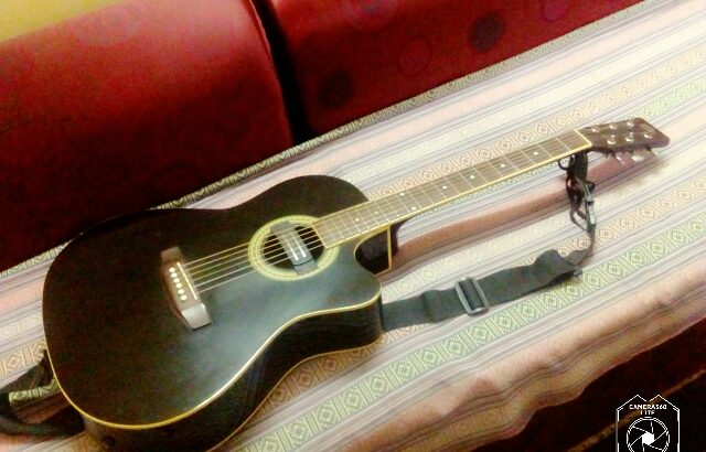 acoustic guitar with bag and belt