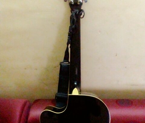 acoustic guitar with bag and belt