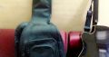 acoustic guitar with bag and belt
