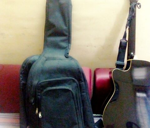 acoustic guitar with bag and belt