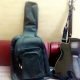 acoustic guitar with bag and belt